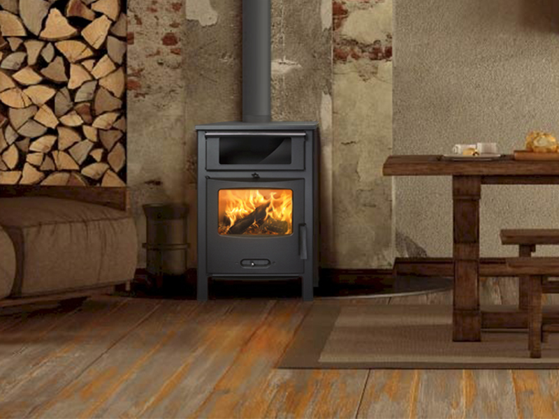 <b>Reference:</b> SAGRA CH <br> 
<b>Description:</b><br>- Steel stove with cast iron door.<br>
- Double combustion system <br>
- Extra clean glass system<br>
- Heat output range: 6.5-11.5kW <br>
- Nominal heat output: 9kW <br>
- Flue socket: ø120 MM<br>
- Heating area: 80 m2 <br>
- Heating volume: 200 m3 <br>
<b>External Dimensions:</b><br>- L= 54CM<br>- W= 46CM<br>- H= 85CM<br>
<b>Firebox Dimensions:</b><br>- L= 52CM<br>- W= 36CM<br>- H= 25CM<br>
<b>Oven Dimensions:</b><br>- L= 52CM<br>- W= 32CM<br>- H= 23CM<br>
<b>Weight:</b> 76KG